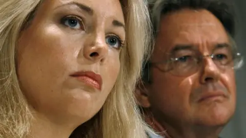 Getty Images Ms Plame and her husband, Ambassador Joe Wilson at a 2006 news conference