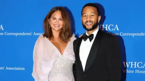 Reuters A glamourous couple, John Legend and his wife Chrissy Teigen, posing on the red carpet