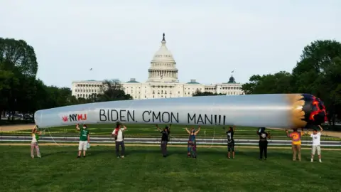 Getty Images Cannabis justice advocates in front of the US Capitol last year