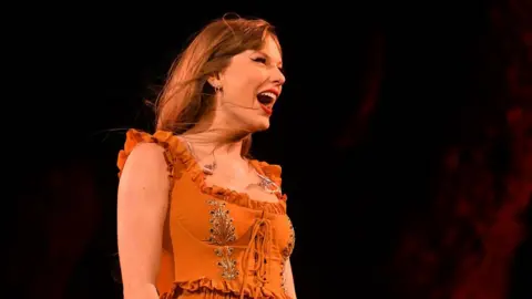 Getty Images Taylor Swift on stage in Argentina