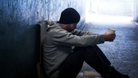 Getty Images Homeless man in subway