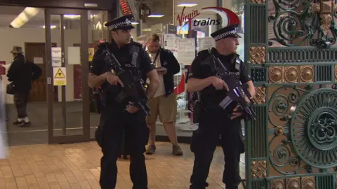 BBC Armed police at Glasgow Central Station