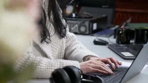 BBC A woman at Ukraine's headquarters for the Treatment of Prisoners of War