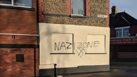 Twitter / @GregPycroft Racist graffiti in Grangetown