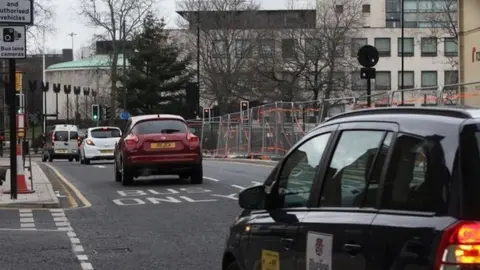 BBC Cars travelling in the bus lane