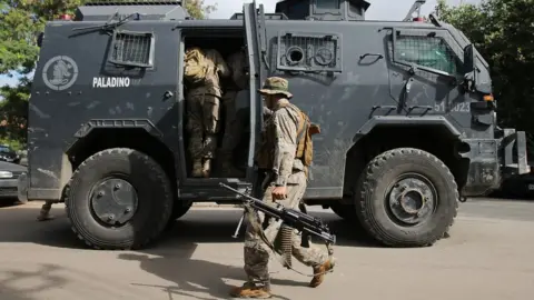 Getty Images soldiers getting in to a truck