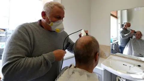 Getty Images Barber working in Brighton