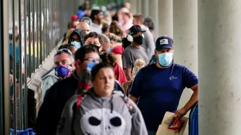 Reuters Hundreds of people line up outside a Kentucky Career Center hoping to find assistance with their unemployment claim in Frankfort, Kentucky, U.S. June 18, 2020.