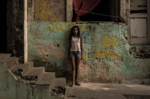 Tariq Zaidi Taina, 12, has been squatting in the IBGE building with her family for 4 - 5 years. Abandoned IBGE building, 'Favela' Mangueira community, Rio de Janeiro, Brazil.