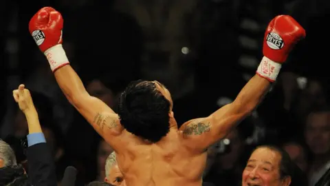 AFP Manny Pacquiao of the Philippines celebrates after knocking out Ricky Hatton of England to win their Welterweight title fight at the MGM Grand Garden Arena on 2 May 2009 in Las Vegas