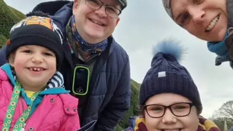 Chris Emily and her family in a group shot