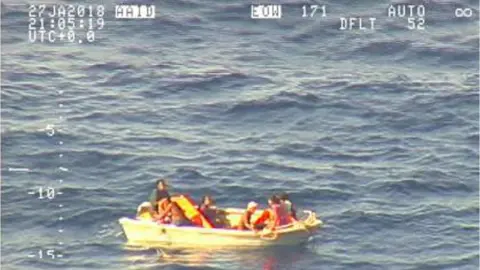 AFP Small dinghy carrying seven people