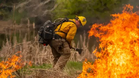 Getty Images A volunteer fire fighter doing training