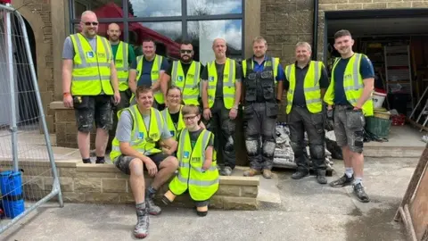 BBC The volunteers with Luke