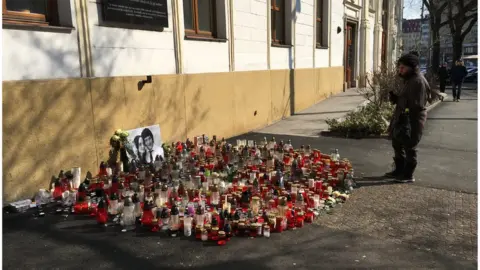 An impromptu memorial to the murdered couple