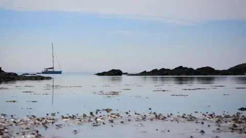 Clare Harding-Lyle A boat sailing at Borth Wen on Anglesey, captured by Clare Harding-Lyle
