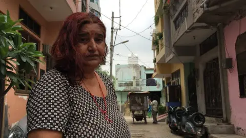 BBC Sunita Devi in front of her house