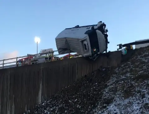 West Yorkshire Fire and Rescue Lorry teetering on motorway bridge