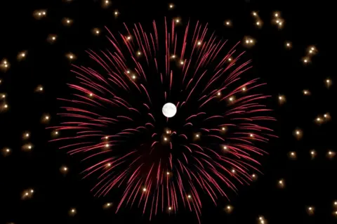 Darrin Zammit Lupi / Reuters Fireworks explode in front of the full moon during celebrations marking the feast of the Assumption of Our Lady in Mosta, Malta, 14 August 2019.