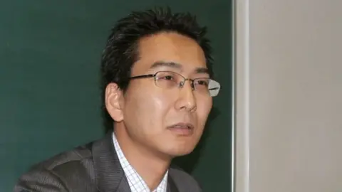 Reuters Japanese journalist Yuki Kitazumi speaks during an interview in Fukuoka, southwestern Japan, 1 April 2013, in this photo released by Kyodo.