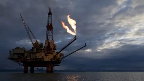 Getty Images A natural gas flare from an offshore oil drilling rig in Alaska.