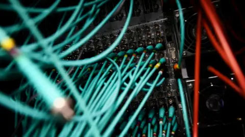 Reuters Cables and computers are seen inside a data centre at an office in the heart of the financial district in London, 15 May 2017