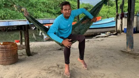 Grey Barreto relaxing in a hammock