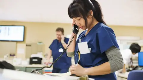 Getty Images Nurse on the phone