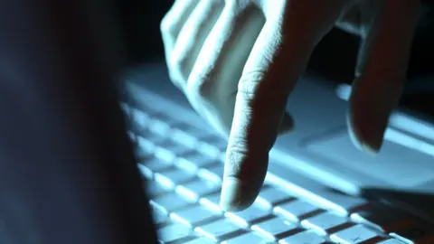 Getty Images Finger striking keyboard