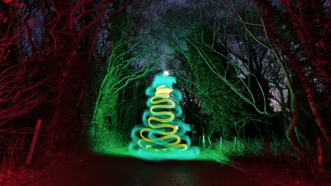 Kevin Jay Light painting of a Christmas tree on a lane in Brightlingsea