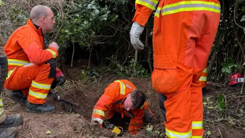 Leicestershire Fire and Rescue Service Crews rescuing dog