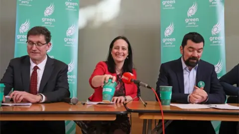 PA Media Green Party politicians at a press conference