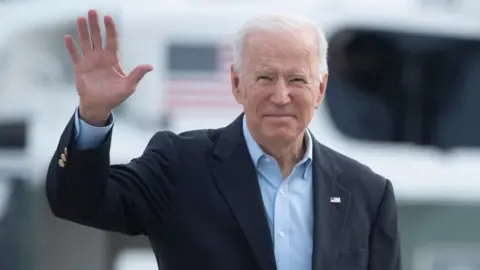 Getty Images Biden waves