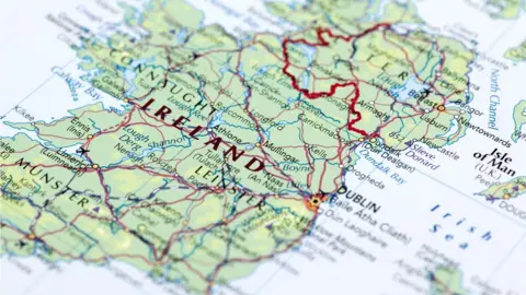 Getty Images/omersukrugoksu Map of the island of Ireland showing land border