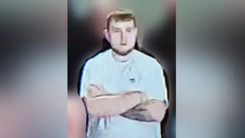 Northumbria Police CCTV image of a man police want to speak to in connection with a flare being thrown during a Sunderland match