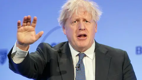 PA Media Former Prime Minister Boris Johnson speaks during the Global Soft Power Summit, at the Queen Elizabeth II Conference Centre, London - 2 March 2023