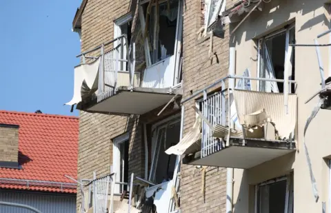 JEPPE GUSTAFSSON/AFP Damaged balconies and windows are seen at a block of flats that were hit by an explosion Friday morning, June 7, 2019