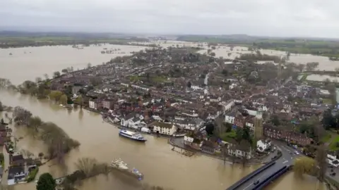 PA Media Flood water continues to surround Upton-upon-Severn, Worcestershire, in the aftermath of Storm Dennis