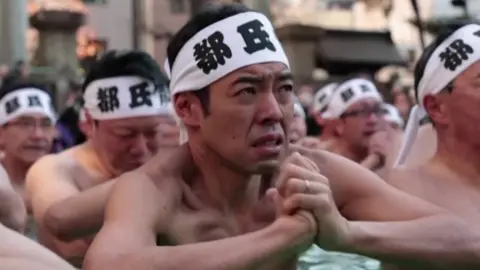 The Tokyo shrine's Shinto ritual is said to purify the soul and bring good health in the new year.