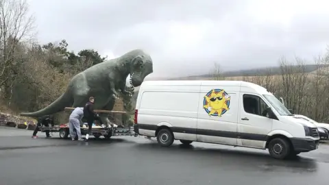 Dan yr Ogof A team loading the dinosaur on to the trailer