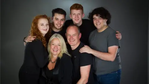 Ruby Thresher Ruby, mum Jo, dad Paul and her three brothers