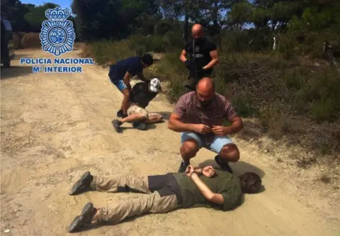 Policia Nacional A Spanish police handout photo showing Jos Brech lying on a dirt road in handcuffs
