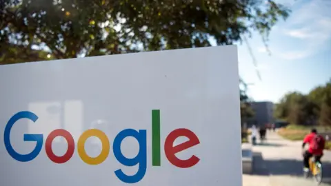 AFP/Getty A man rides a bike passed a Google sign and logo at the Googleplex in Menlo Park, California on November 4, 2016.