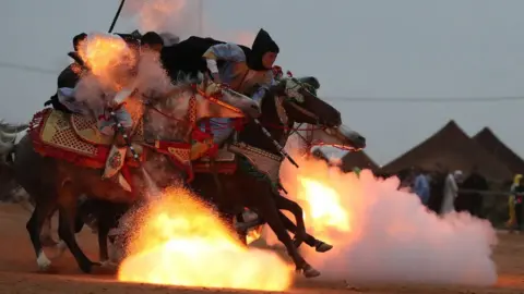 AFP Horsemen at the Tan-Tan Moussem Berber festival, Tan-Tan, Morocco - Sunday 8 July 2018