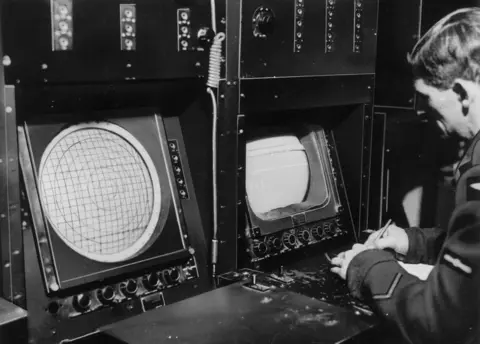 Getty Images An RAF radar operator pictured in 1945