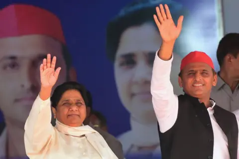 Getty Images Bahujan Samaj Party (BSP) president Mayawati (L) and Samajwadi Party (SP) president Akhilesh Yadav (R) wave at the SP-BSP-RLD alliances first joint rally in Deoband in Uttar Pradesh state on April 7, 2019.