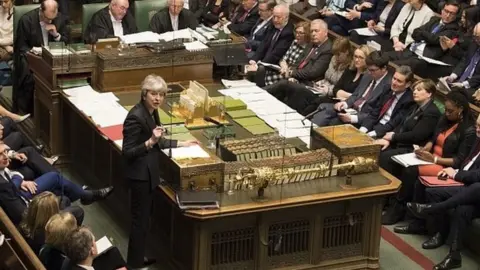 PA Theresa May addressing the House of Commons