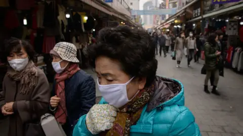 Getty Images Elderly people wearing face masks