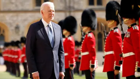 Getty Images Joe Biden inspecting the troops