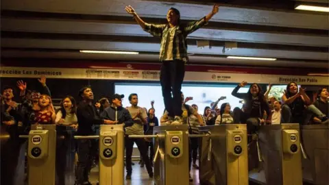 AFP Students demonstrate at Los Heroes metro station during a mass fare-dodging protest in Santiago, Chile, on October 18, 2019